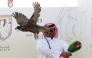 A falconer releasing his falcon during the qualification round.