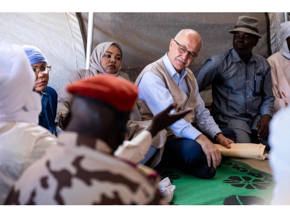 United Nations (UN) High Commissioner for Refugees, Barham Salih (2nd R), talks with a Sudanese refugee, in Farchana, Ouaddai, on January 14, 2026. (Photo by Joris Bolomey / AFP)