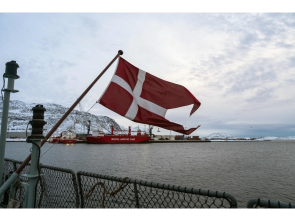 The Danish flag flies form the deck of the HDMS Knud Rasmussen Royal Danish Navy patrol vessel, moored at the harbour in Nuuk, Greenland on January 16, 2026. (Photo by Alessandro Rampazzo/ AFP)