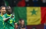 Senegal's forward #10 Sadio Mane celebrates his goal with Senegal's forward #13 Iliman Ndiaye during the Africa Cup of Nations (CAN) semi-final between Senegal and Egypt at the Grand stadium in Tangiers on January 14, 2026. (Photo by Sebastien Bozon / AFP)
