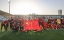 Team China pose for a photograph to celebrate qualifying to the knockout stage after the 2026 AFC U23 Asian Cup group D match between China and Thailand in Riyadh, Saudi Arabia, Jan. 14, 2026. (Xinhua/Wang Haizhou)