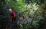 Joint search and rescue teams climb towards the suspected crash site of an Indonesia Air Transport turboprop plane in the Bulusaraung Mountains, South Sulawesi, Indonesia, January 18, 2026. (Photo by Muchtamir / AFP)