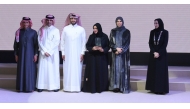 Minister of Education and Higher Education H E Lolwah bint Rashid bin Mohammed Al Khater honouring the representative of a private school for participating in the “Community Responsibility of Private Schools and Kindergartens” project.