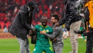 Senegal's forward #10 Sadio Mane and team members celebrate their victory at the end of the Africa Cup of Nations (CAN) final football match between Senegal and Morocco at the Prince Moulay Abdellah Stadium in Rabat on January 18, 2026. (Photo by FRANCK FIFE / AFP)