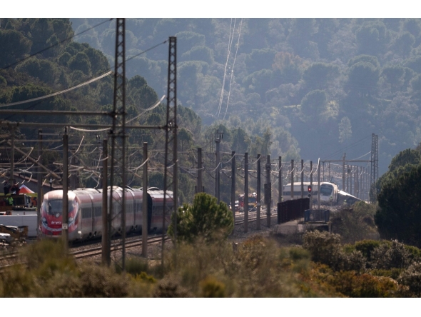 Derailed trains are seen as rescue efforts continue at the site of a deadly train accident in Adamuz, southern Spain, on January 19, 2026.(Photo by JORGE GUERRERO / AFP)
