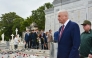 Russia's Interior Minister Vladimir Alexandrovich Kolokoltsev (R) paying tribute to Soviet internationalist soldiers by laying a floral offering at the mausoleum dedicated to these fighters as part of his visit agenda to Cuba, in Havana on January 20, 2026. (Photo by Omara GARCIA MEDEROS / ACN / AFP)