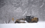 A snow plow moves along Wade Avenue as snow falls on January 17, 2018 in Raleigh, North Carolina. Lance King/Getty Images/AFP