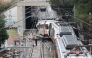 A picture taken on January 21, 2026 shows a regional service train the morning after it collided with a collapsed wall, killing one person and injuring seriously five, between Sant Sadurni d'Anoia and Gelida, near Barcelona.