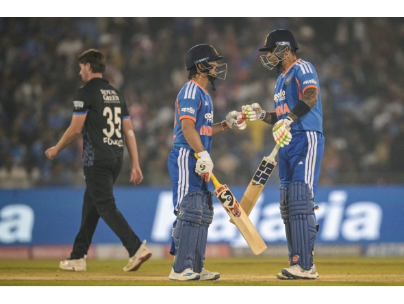 India's Ishan Kishan and Suryakumar Yadav bump their fists during the second Twenty20 international cricket match between India and New Zealand at the Shaheed Veer Narayan Singh International cricket Stadium in Raipur on January 23, 2026. (Photo by Dibyangshu SARKAR / AFP)