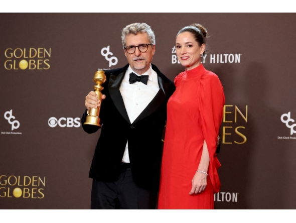 (L-R) Kleber Mendonça Filho and Emilie Lesclaux, winners of the Best Motion Picture – Non-English Language Award for 