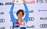 Winner Italy's Giovanni Franzoni celebrates on the podium with his trophy after the Men's Downhill event of the FIS Alpine Skiing World Cup in Kitzbuhel, Austria, on January 24, 2026. (Photo by Joe Klamar / AFP)