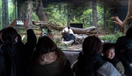 People watch the giant panda Lei Lei eat during the final day for public viewing before its departure for China, at Ueno Zoo in Tokyo on January 25, 2026. Panda twins Lei Lei and Xiao are set to return to China on January 27, leaving Japan without a panda for the first time since the two Asian giants normalised the diplomatic ties in 1972.(Photo by Philip FONG / AFP)