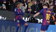 :Barcelona's Spanish forward #10 Lamine Yamal (L) celebrates scoring his team's third goal with Barcelona's Spanish midfielder #16 Fermin Lopezduring the Spanish league football match between FC Barcelona and Real Oviedo at Camp Nou Stadium in Barcelona on January 25, 2026. (Photo by Josep LAGO / AFP)