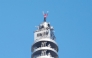 US rock climber Alex Honnold raises his arms from the top of the Taipei 101 building after he successfully free soloed the landmark skyscraper without ropes or safety gear in Taipei on January 25, 2026. (Photo by I-HWA CHENG / AFP)