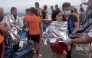 This screen grab from video footage taken and received on January 26, 2026, from Governor Mujiv Hataman shows rescuers assisting survivors of the sunken MV Trisha Kerstin 3 at a port in Isabela, Basilan province. A ferry with more than 350 people onboard sank on January 26 morning in choppy seas off the southern Philippines, leaving at least 15 dead and 28 still missing, the coast guard said. (Photo by Handout / Governor Mujiv Hataman / AFP)