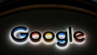 This photograph taken on January 22, 2026, shows a sign of US technology company Google displayed during the World Economic Forum (WEF) annual meeting in Davos. (Photo by Fabrice COFFRINI / AFP)
