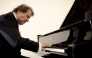 Rudolf Buchbinder playing the piano. 
