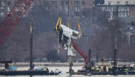A crane removes airplane wreckage from the Potomac River on Feb. 3, 2025. Photo credit: Jabin Botsford/The Washington Post
