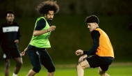 Al Sadd's Akram Afif (left) in action during a training session. 