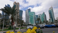 Cars drive along the Corniche area on a cloudy day in Doha on January 26, 2026. (Photo by Karim JAAFAR / AFP)
