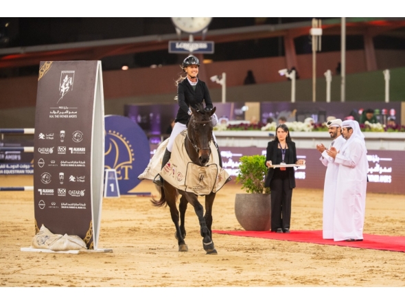 Kristen Vanderveen celebrates with her 12-year-old gelding Bull Run’s Jireh after winning the CSI5* jump-off 155cm class during the final round of the HH The Father Amir’s Prix at Al Shaqab yesterday. The winners of the class were presented trophies by Abdullah al-Qashouti, the tournament's Marketing and Communications Director.