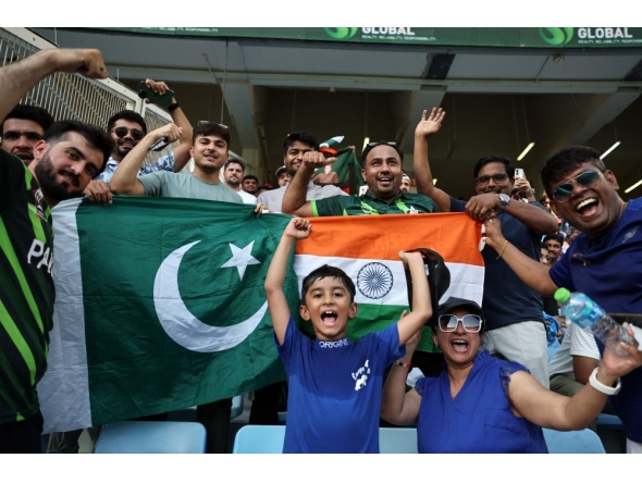 File photo: Pakistan and India fans cheer before the start of the Asia Cup 2025 Twenty20 international cricket match between India and Pakistan at the Dubai International Stadium in Dubai on September 14, 2025. (Photo by Fadel Senna / AFP)