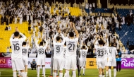 Al Sadd players acknowledge their fans after a win over Al Gharafa.