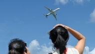 An Airbus' A350-1000 airliner takes part in an aerial display at the Singapore Airshow in Singapore on February 3, 2026. (Photo by Roslan Rahman / AFP)