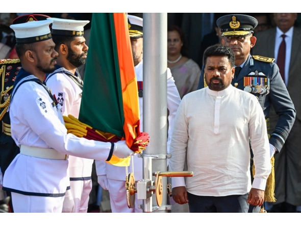 Sri Lanka's President Anura Kumara Dissanayake (front, R) arrives to hoist the national flag during the country's 78th Independence Day celebrations at Independence Square in Colombo on February 4, 2026. (Photo by Ishara S. KODIKARA / AFP)