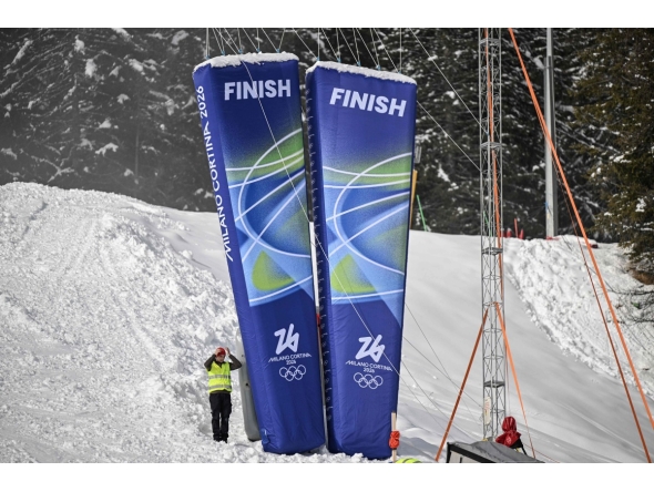 A staff stands next to pillars reading 