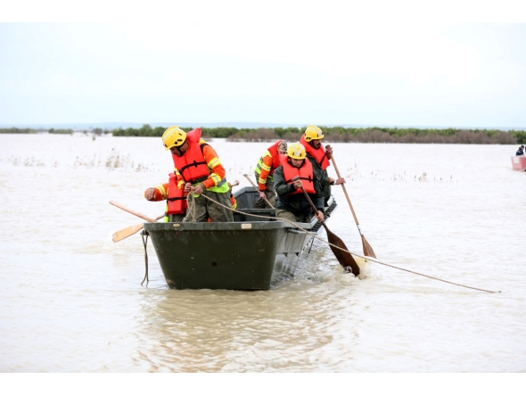 Civil defence rescuers ride in a boat on flood waters in the Sidi Kacem region, in northwestern morocco on February 5, 2026. (Photo by AFP)
