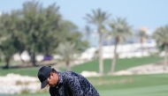 Patrick Reed of the United States lines up a crucial putt on Day 1 of the 29th Qatar Masters yesterday.