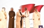 Senior Manager of the City Control and Smart Operations Center at Qatari Diar, Eng. Khalifa Al Mana, receiving the award from officials in Kuwait.
