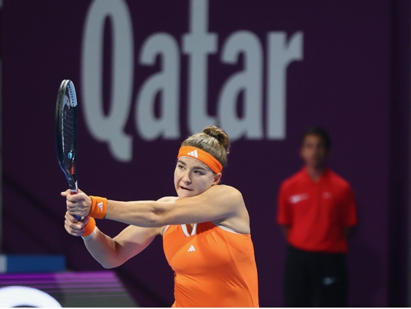 Karolina Muchova hits a return to Jaqueline Cristian.