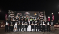 QRC Director General Sheikh Jabor bin Khalid Al Thani with the podium winners of the fifth round. 
