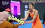 Karolina Pliskova of the Czech Republic signs autographs after the match against Amanda Anisimova of the United States.