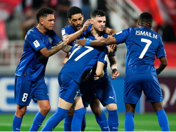 Al Duhail players celebrate the equaliser.