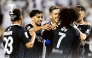 Al Sadd's players celebrate a goal.
