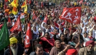 Farmers and trade union workers shout slogans during a nationwide strike over government policies and other issues in Amritsar on February 12, 2026. (Photo by Narinder Nanu / AFP)