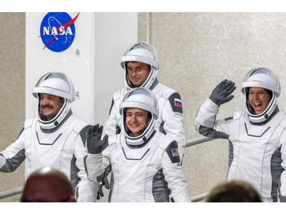NASA astronauts Jessica Meir (C), commander, and Jack Hathaway (L), pilot, ESA (European Space Agency) astronaut Sophie Adenot (R), and Roscosmos cosmonaut Andrey Fedyaev (2ndL) walk out as they prepare to travel to the SpaceX Falcon 9 rocket with the company's Dragon spacecraft at Space Launch Complex 40 for the Crew-12 mission at Cape Canaveral Space Force Station in Florida, on February 13, 2026. (Photo by Jim WATSON / AFP)