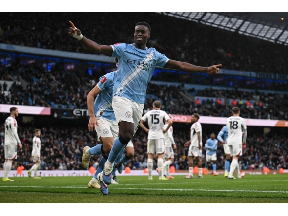 Manchester City's English defender #15 Marc Guehi celebrates after scoring a goal during the English FA Cup third round football match between Manchester City and Salford City at the Etihad Stadium in Manchester, north west England, on February 14, 2026. (Photo by Oli SCARFF / AFP)