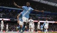 Manchester City's English defender #15 Marc Guehi celebrates after scoring a goal during the English FA Cup third round football match between Manchester City and Salford City at the Etihad Stadium in Manchester, north west England, on February 14, 2026. (Photo by Oli SCARFF / AFP)
