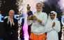 Karolina Muchova celebrates with the winner's trophy. QTSBF President Nasser Al Khelaifi and FIFA President Gianni Infantino are also present.
