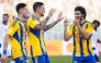 Al Gharafa’s Joselu (centre) celebrates with teammates.  