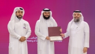 Undersecretary of the Ministry of Awqaf and Islamic Affairs H E Dr. Sheikh Khalid bin Mohammed bin Ghanem Al Thani honouring a winner.