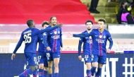 Desire Doue (right) celebrates with teammates after scoring Paris Saint-Germain’s third goal against Monaco.