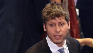 OpenAI CEO Sam Altman attends the AI Impact Summit in New Delhi on February 19, 2026. (Photo by Ludovic MARIN / AFP)