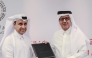 Director General of Qatar Press Center Sadiq Al-Amari and Executive Director of the Middle East Council on Global Affairs Khalid Al-Jaber exchanging documents after signing the agreement.