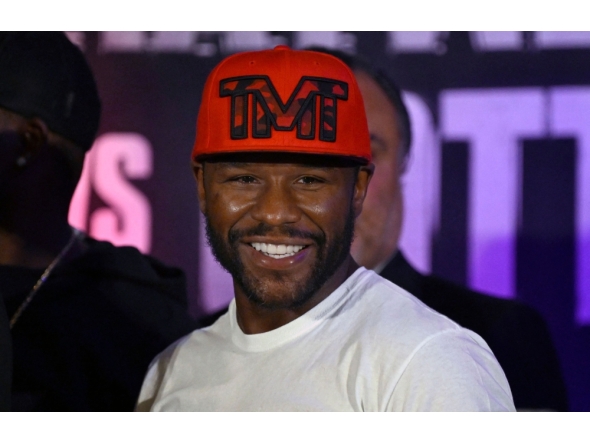 US boxer Floyd Mayweather Jr. smiles during the weighing ceremony for his upcoming exhibition fight against John Gutti III in Mexico City on August 23, 2024. . (Photo by Alfredo Estrella/ AFP)