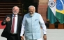 India's Prime Minister Narendra Modi (R) holds hands with Brazil's President Luiz Inacio Lula da Silva as they walk before their meeting at the Hyderabad House in New Delhi on February 21, 2026. (Photo by Sajjad Hussain / AFP)